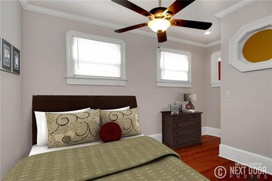 Guest bedroom on main level with pretty stained gl