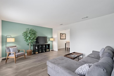 Living area featuring wood finished floors and ba