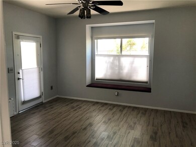 Master Bedroom with seat at window. Doggie door &
