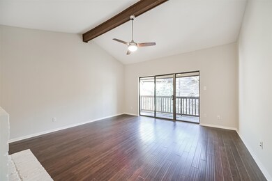 This bright living room features high ceilings wit