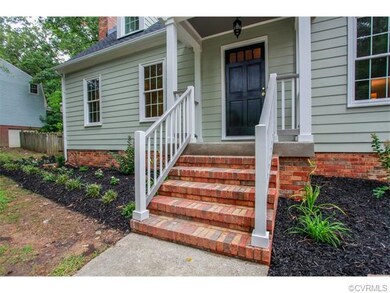 Close-up of front stoop and renovated porch.