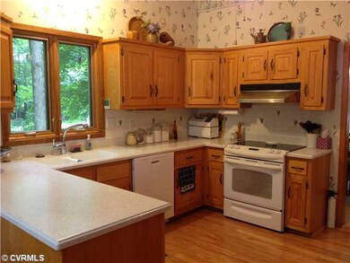 Kitchen - Corian Countertops, Hardwood Floors and 