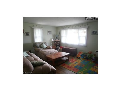 Huge living room with hardwood floor and a large f