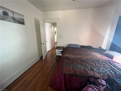 Bedroom featuring hardwood flooring