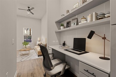 Home office featuring built in study area, light 