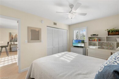 Bedroom featuring a closet, ceiling fan, and light