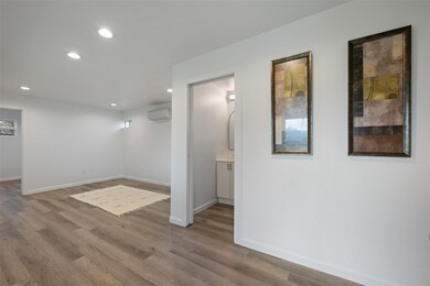 Below grade area with wood finished floors, reces