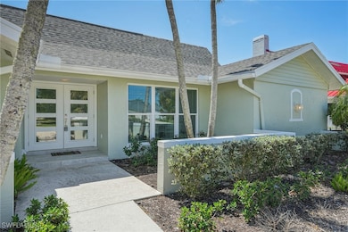 Entrance to property with french doors, stucco sid