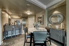 Dining area featuring ornamental molding