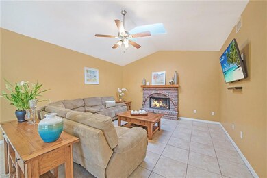 Family room with wood burning fireplace.