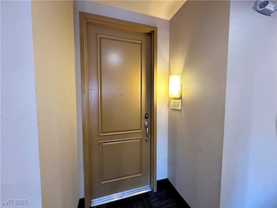 Entrance to property with stucco siding