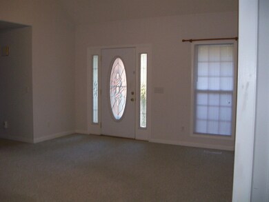 Front Door Leading To Living Room And Formal Dining Room !
