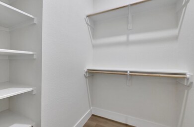 large walk-in closet with plenty of storage