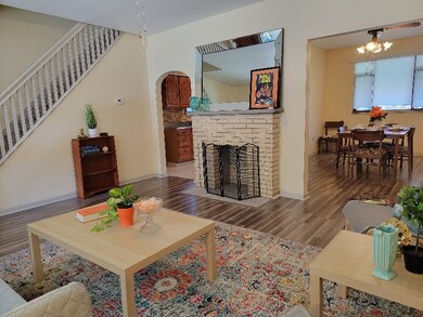 Living room features a decorative fireplace