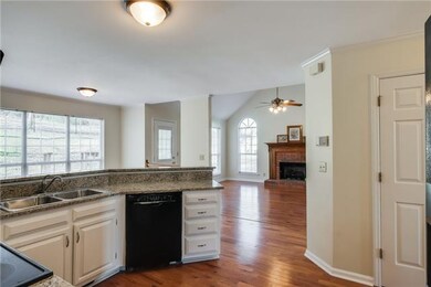 From your incredible kitchen, look out into the den where family and friends will gather. 