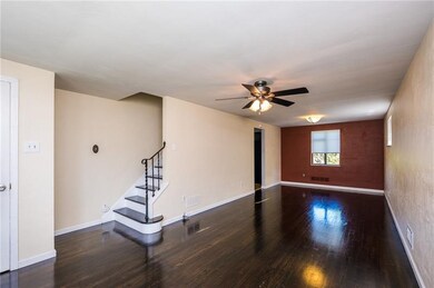 Huge open Living Room/Dining Room with gleaming ha