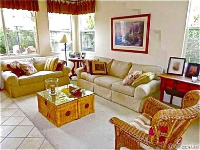 Arches along the entryway lead to a warm and welco