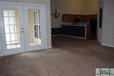 Great room showing patio and dining room
