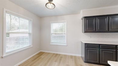 Unfurnished dining area with light hardwood / wood