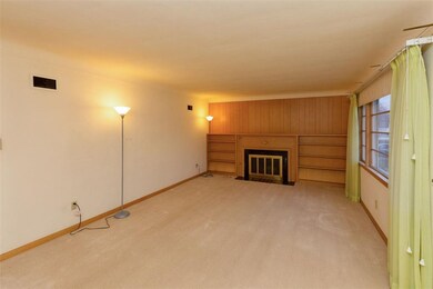 Large living room with custom build shelves surrou