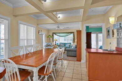 Dining area featuring crown molding, a ceiling fan