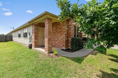 View of property exterior featuring brick siding