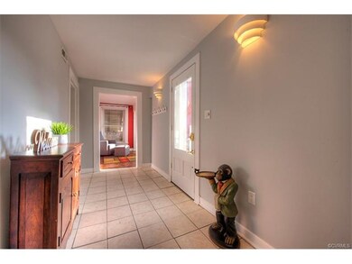 Foyer with sconce lighting, plenty of room for a b