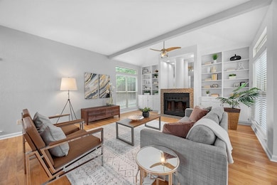 Living room featuring light wood-style flooring, 