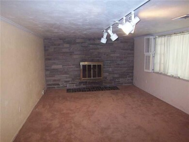 Basement/Game Room. Full stone wall fireplace is l