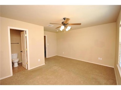 Unfurnished bedroom featuring carpet, baseboards,