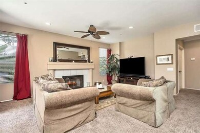 Large family room with plush carpeting, recessed n