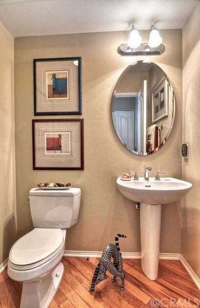 Downstairs powder room with gorgeous hardwood floo