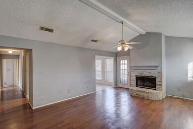 Unfurnished living room with dark wood-type floori