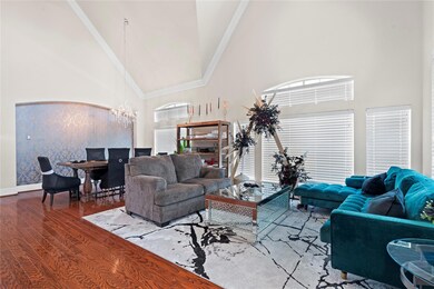 Living room with high vaulted ceiling, an inviting