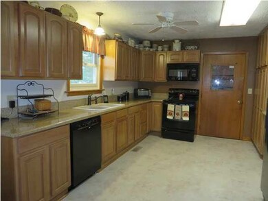 Kitchen has been updated with new cabinets....