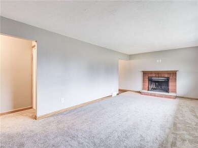 Views of the brick fireplace in the living room fo