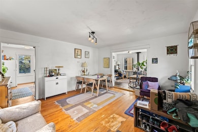 Living room with light wood-style flooring