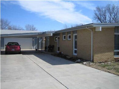 Oversized 2-car garage + carport