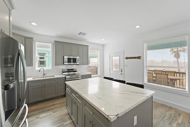 Stunning wood-inspired flooring and sleek granite