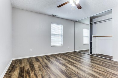Unfurnished bedroom featuring dark wood-type floor