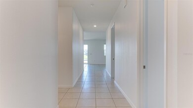 Entry hall from front door looking into the great room.  Ceramic tile floors throughout.