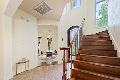 Staircase with tile patterned floors and recessed