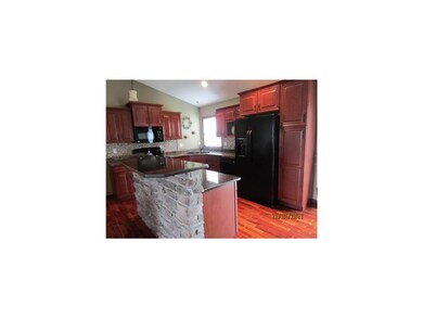 Kitchen. Beautiful cherry wood cabinets and floori