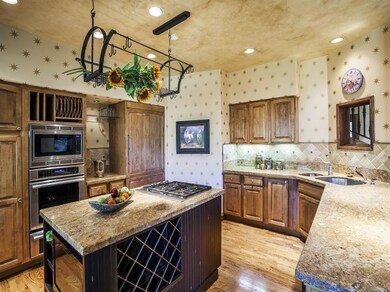 Gourmet kitchen with Wolf Range and Ther