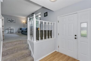 Spacious Entryway Leads To Living Room