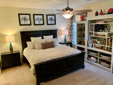 Bedroom featuring light colored carpet and a ceil