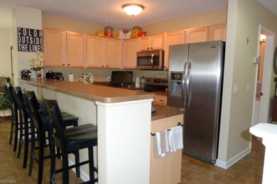 The kitchen offers stainless steel appliances and 