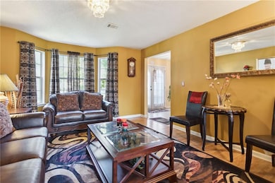 Living room with hardwood / wood-style flooring an