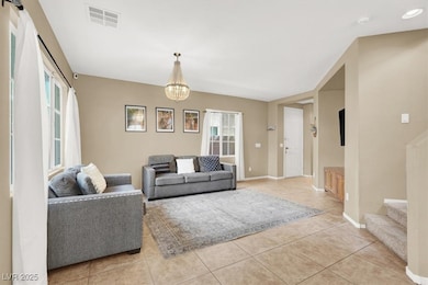Living area with light tile patterned flooring, st