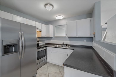 Kitchen featuring appliances with stainless steel